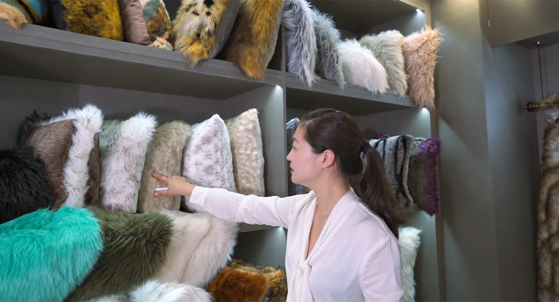Faux fur cushion samples on the Tulip sample-room wall