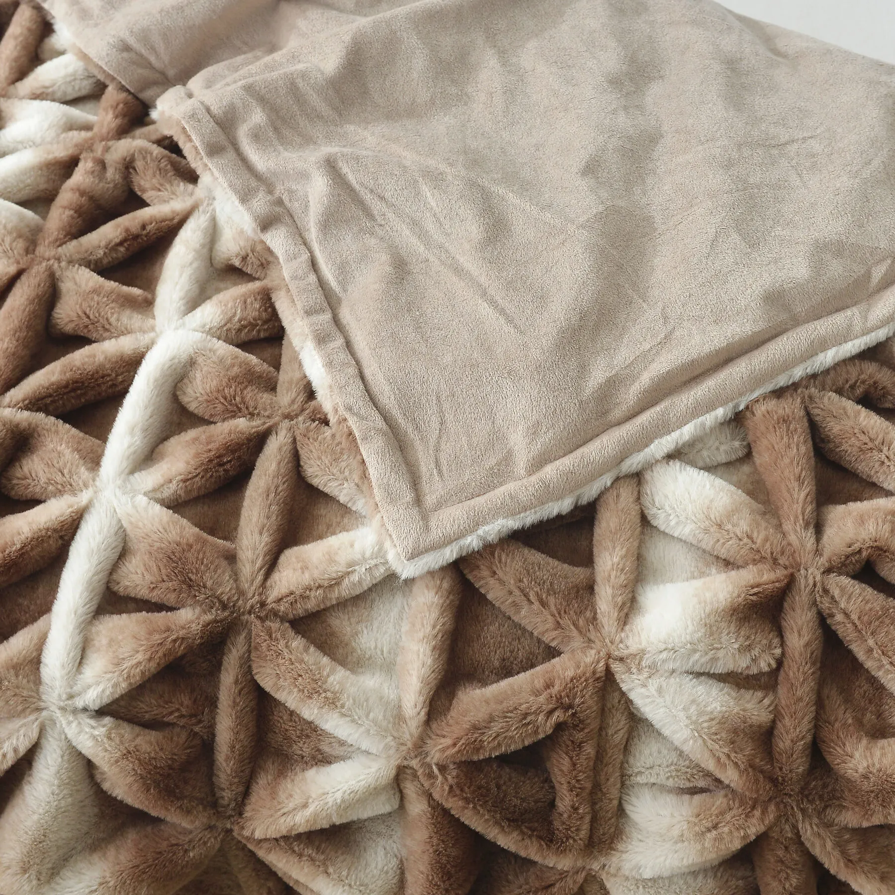 3D carved geometric faux fur throw with suede reverse